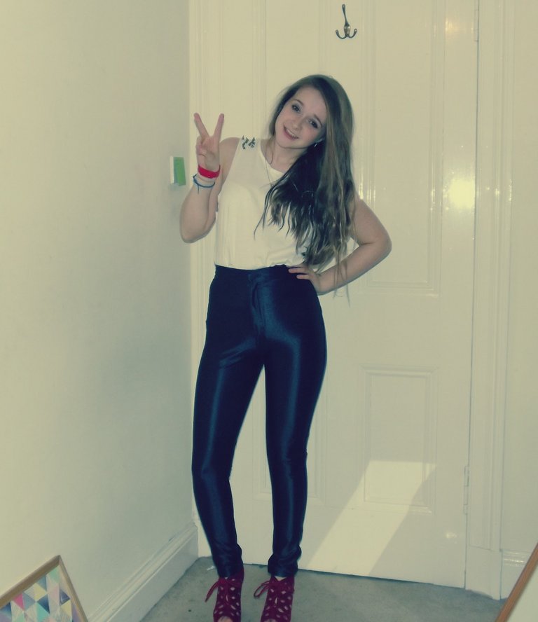 girl wearing black disco pants.j
