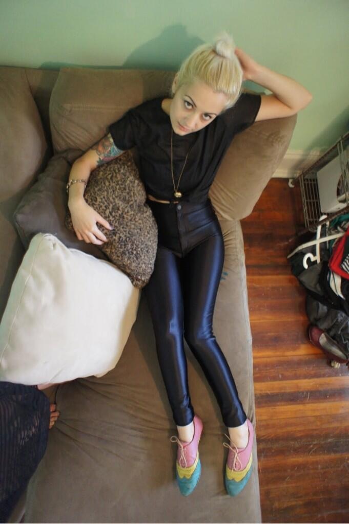 black disco pants lounging on co
